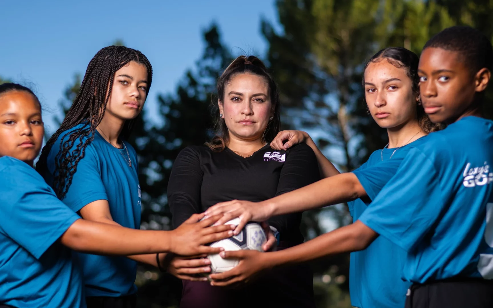 teens with soccer ball